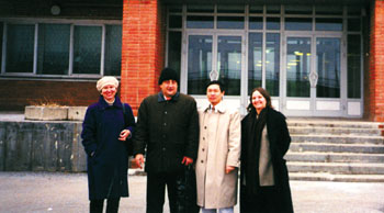 Dr. Yi-Wei Tang, third from left, stands with Dr. Olga Dorohina and Dr. Vladimir Petrov of  VECTOR, and Jessica Kaplan, program specialist for ISTC, outside VECTOR in Siberia.