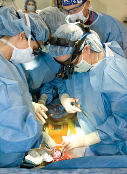 Karla Christian, M.D., (right), works to re-route the veins in Amenah’s heart. (photo by Neil Brake)