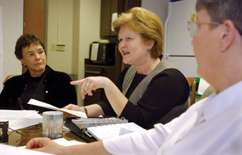 Yarbrough talks with her staff during the Health and Wellness manager's meeting, including Ellen Trice, left, and Diane Neighbors, right. Health and Wellness encompasses Health Plus, Work Life Connections/EAP, the Child Care centers, and the Occupational Health Center.  Photo by Dana Johnson