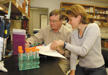 Strauss and research fellow Ute Spiekerkotter, Ph.D., discuss results of recent findings. (photo by Anne Rayner Pollo)