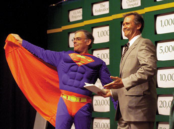 Posing as Superman, Urmy helps kick off last year's Community  Giving Campaign. (photo by Dana Johnson)