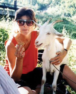 Carol poses with a goat she befriended in Bosnia. She has aspirations one day to become a goat farmer.