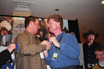 Singer-songwriter Gary Chapman, left, and Dr. Reid Thompson congratulate each other on their team's first-place finish in the celebrity ski races.