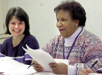 From left, Mary Helen Collins and Diane Boyd, both R. N.s, laugh as they try to pronounce their Spanish vocabulary in a Spanish course. (photo by Dana Johnson)