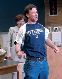Bruce Jacobs rips off a white T-shirt to reveal his match at the University of Pittsburgh Medical Center.