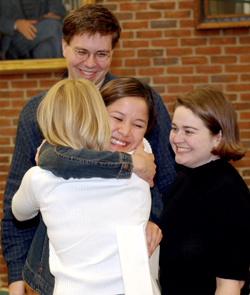 Joy Duong, who matched at Vanderbilt in Ob-Gyn, hugs her classmates Thursday during the event.