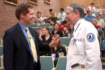 Dr. Seth F. Berkley, president and CEO of the International AIDS Vaccine Initiative, talks with Dean Steven G. Gabbe at Tuesday’s presentation.