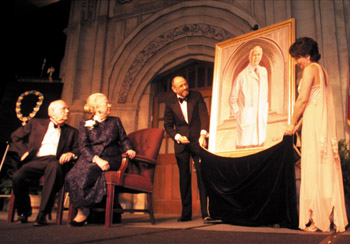 Dean and Mrs. Chapman react as associate deans Dr. Gerald Gotterer and Dr. Deborah German unveil a portrait of Chapman by Ann Street. A jeweler's copy of the Order of the Seraphim, Sweden's highest honor, was also awarded to Chapman.