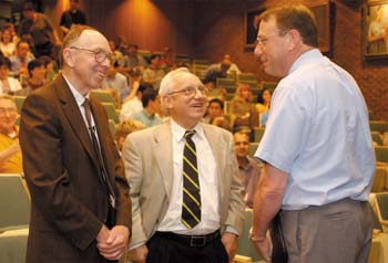 Keynote speaker Russell F. Doolittle, Ph.D., left, talks with Dr. Jacek Hawiger, Oswald T. Avery Professor of Microbiology and Immunology, and Dr. William Stead, associate vice chancellor for Health Affairs, at the lecture Tuesday.