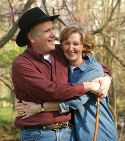 Greene hugs his wife of 37 years, Linda, on a day spent at their country home. Photo by Dana Johnson