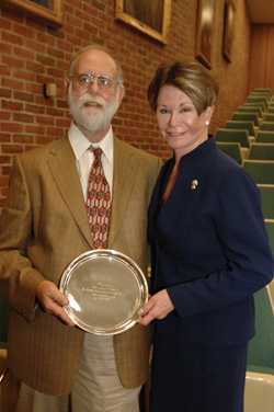Ken Wallston, Ph.D., professor of Psychology in Nursing at Vanderbilt University School of Nursing, and VUSN Dean Colleen Conway-Welch, Ph.D., show off the Joe B. Wyatt Distinguished University Professor Award presented to Wallston at this week’s Spring Faculty Meeting. (photo by Anne Rayner)