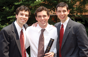 The Grippo brothers, from left, Ryan Grippo, first-year VUSM student, 2003 graduate Dr. Dan Grippo, and 2001 graduate Dr. Jim Grippo celebrate after the graduation ceremony. Dan received his diploma from his brother Jim during the ceremony.