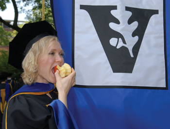 Jennifer Sparks, Ph.D., grabs a quick bite before the Graduate School ceremony. (photo by Neil Brake)