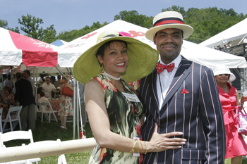 The day of races was enjoyed by thousands, including Kevin Churchwell, M.D., and his wife, Gloria. (photo by Kats Barry)