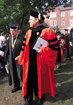 Medical school Dean Steven Gabbe and Dean Emeritus John Chapman lead the processional of medical school faculty and students during this year's graduation ceremony.  This was Dean Gabbe's first graduation at Vanderbilt. (Photo by Dana Johnson)