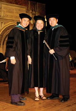David Yung-Ping Chong, right, received his diploma from his mother, Catherine Chong, M.D., and brother, Paul Chong, M.D. (photo by Paul Levy)