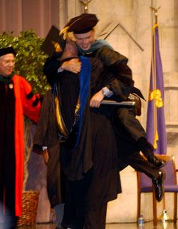 Andrew Camarata is lifted off the ground by his father, Stephen Camarata, Ph.D., after he presented his son with his diploma at the VUSM graduation ceremony in Langford Auditorium.
Photo by Dana Johnson