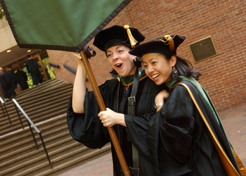 Vanderbilt University School of Medicine Class of 2005 president Lesley French, left, shares a laugh with classmate Carolyn Nguyen as they line up before commencement.
photo by Dana Johnson
