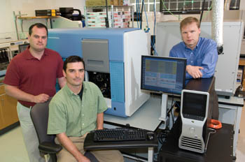 David Sexton, Robert Woodhall and Shawn Levy, Ph.D., left to right, with the new Illumina Genome Analyzer. (photo by Neil Brake)