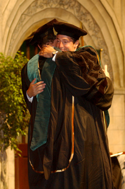 Aron Rosenthal hugs his father Alan Rosenthal, M.D.  Alan Rosenthal awarded his son his diploma. 