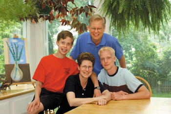 Clayton recommends parenthood: "I call them grace on the hoof." With John, 12, and Jim, 17, both students at The University School, and husband, Jay. (photo by Dana Johnson)