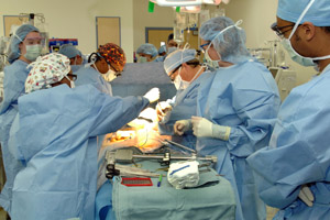 The surgical team transplants a new liver into Michayla Nelson. (photo by Neil Brake)