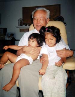 Inagami with his two oldest granddaughters, Emi and Miya.