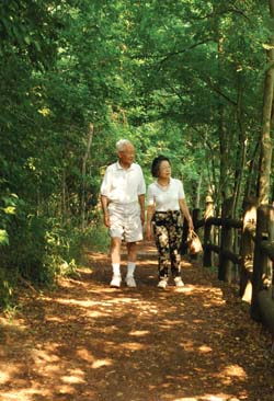 Tadashi and Masako Inagami stroll through Radnor Lake State Park.