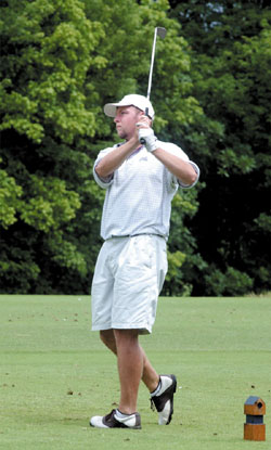Tennessee Titans player Craig Hentrich tees off at the tournament.