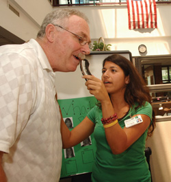 Kim Amsilli shaves off longtime Dayani Center excercise physiologist Sam Ewing’s mustache. 