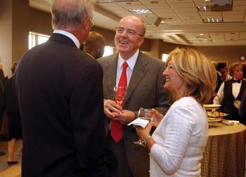 Alastair J.J. Wood, M.B., Ch.B., and his wife, Margaret Wood, M.D., share a laugh with Tom Collins, one of his patients, during Tuesday’s reception honoring Wood’s career at Vanderbilt.
Photo by Dana Johnson