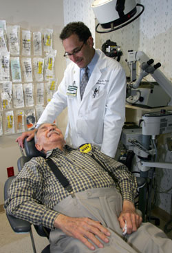 Paul Sternberg, M.D., chats with patient Boggs Huff before administering the new treatment for wet age-related macular degeneration in the <a href='http://www.vanderbilthealth.com/eyeinstitute'>Vanderbilt Eye Institute</a>.
Photo by Neil Brake