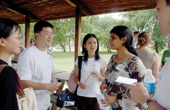 From left, graduate students Louise Li, Kefeng Sun, Luping Lin and Kavitha Surendhram talk at the orientation.
Photo by Susan Urmy