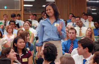 Sue Chern is all smiles as she is introduced to her fellow medical school classmates during the first-year orientation in Light Hall Monday morning. 
Photo by Dana Johnson