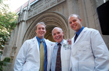 Allen Kaiser, M.D., a graduate of Vanderbilt Medical School and vice chair of the department of Medicine and vice chair for Clinical Affairs, celebrates with his two sons Daniel, left, and Clay, right, after they received their white coats last Friday. (photo by Anne Rayner)