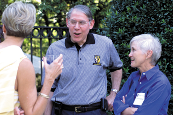 Dr. Steven Gabbe and his wife Dr. Patricia Temple greet guests at the Dean's Picnic held for the medical school students Monday night.