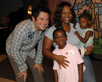 Jay DeMarcus poses for a photo with patient Autumn Miller, right, her mother, Kisha Miller, and their friend, James Whitmore. (photo by Dana Johnson)