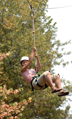 Alyssa Johnson goes for a ride on the zip line during last week’s outing. (photo by Neil Brake)