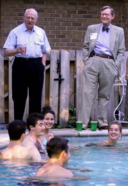 Dean John Chapman and Chancellor E. Gordon Gee share a laugh with incoming medical students at Chapman’s annual pool party. (photo by Dana Johnson)