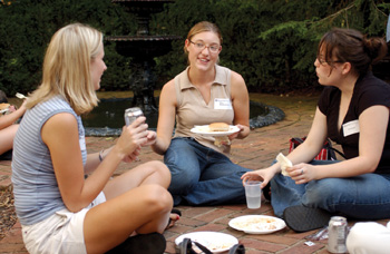 From left,  Amanda Lowry, Erin McHenry and Heidi Shults spend time together at the student barbeque at Conway-Welch’s house Monday evening. Dana Johnson