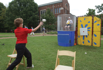 Medical School Dean Steven G. Gabbe, M.D., prepares to be dunked by his assistant, Benita Bobbitt. Photo by Anne Rayner