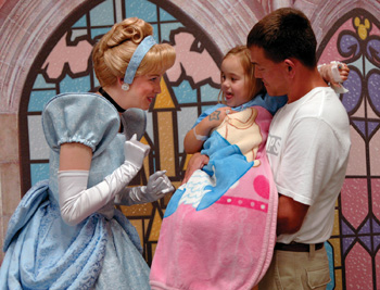 Cinderella shares a laugh with patient Ina Morris and her dad, Charles.