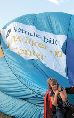 Tonya Rhodes helps get the Vanderbilt Bill Wilkerson Center balloon inflated.