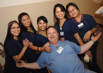 From left, Beth Duncan, Gemma Huffaker, Irenea Matlock, Lucy Pollard and Karen Tolang of the Service Center surround David Delashmitt, of Support Services, at Tuesday’s Night Owl Howl, the Employee Celebration Month party for VUMC night shift workers. See page 8 for more photos and a calendar of upcoming events. (photo by Dana Johnson)