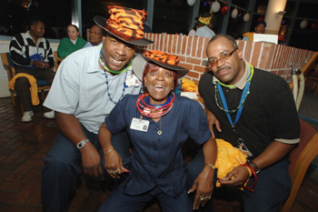 Leslie Rogers, left, Carol Simpson and Daris Merriweather celebrate in style at Tuesday’s Night Owl Howl.
Photo by Anne Rayner