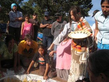 Aaron Dawes, front row, second from left, participates in a ceremony of the Diné people of the Four Corners region.