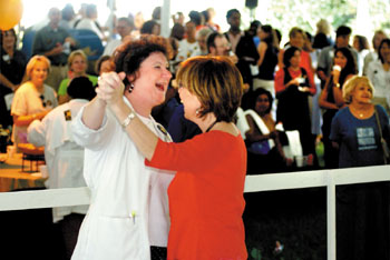 Randee White, RN, left, dances with her friend Karen Robinson, RN, while Soul Incision plays during the lunch hour at the Kick-Off party.