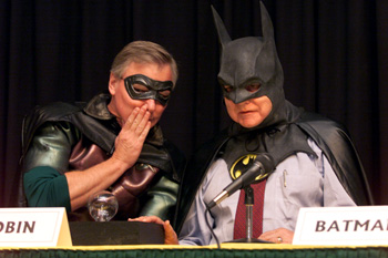 “Robin the Boy Wonder,” Mark Penkhus, Executive Director and Chief Executive Officer of VUH, whispers an answer to “Batman,” Dean John E. Chapman of the School of Medicine, during the superhero Jeopardy game show. (photo by Dana Johnson)
