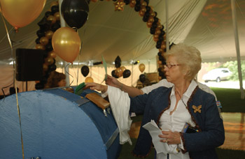 Janet Frazier puts her name in the hopper for door prizes at Tuesday’s kickoff.
Photo by Susan Urmy