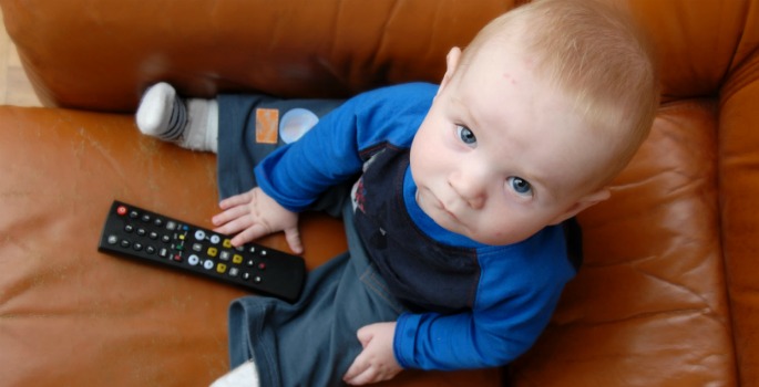 Baby holding remote